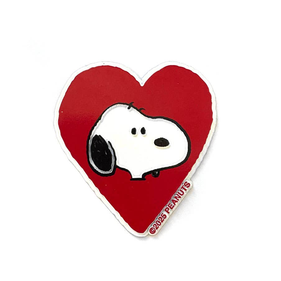 Heart-shaped magnet with snoopy on a red background
