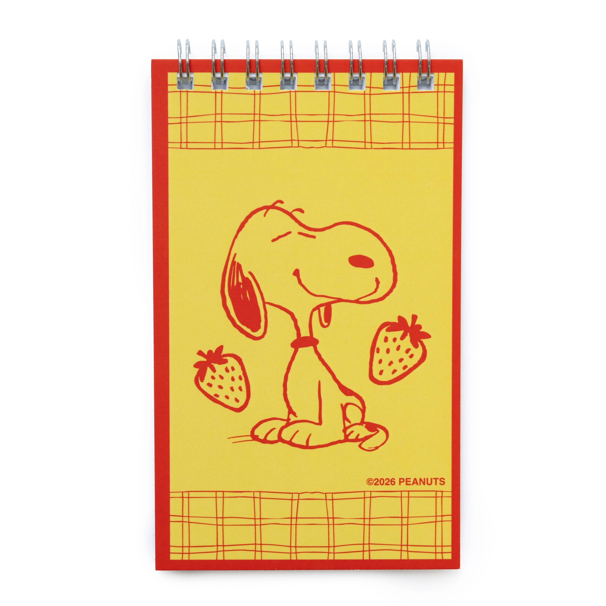 Notebook with a red border featuring a cartoon dog holding strawberries on a yellow background.