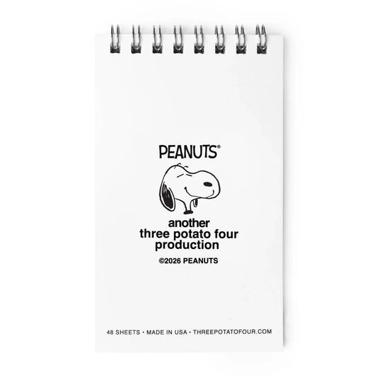 Small notebook with Peanuts logo and text on a white background