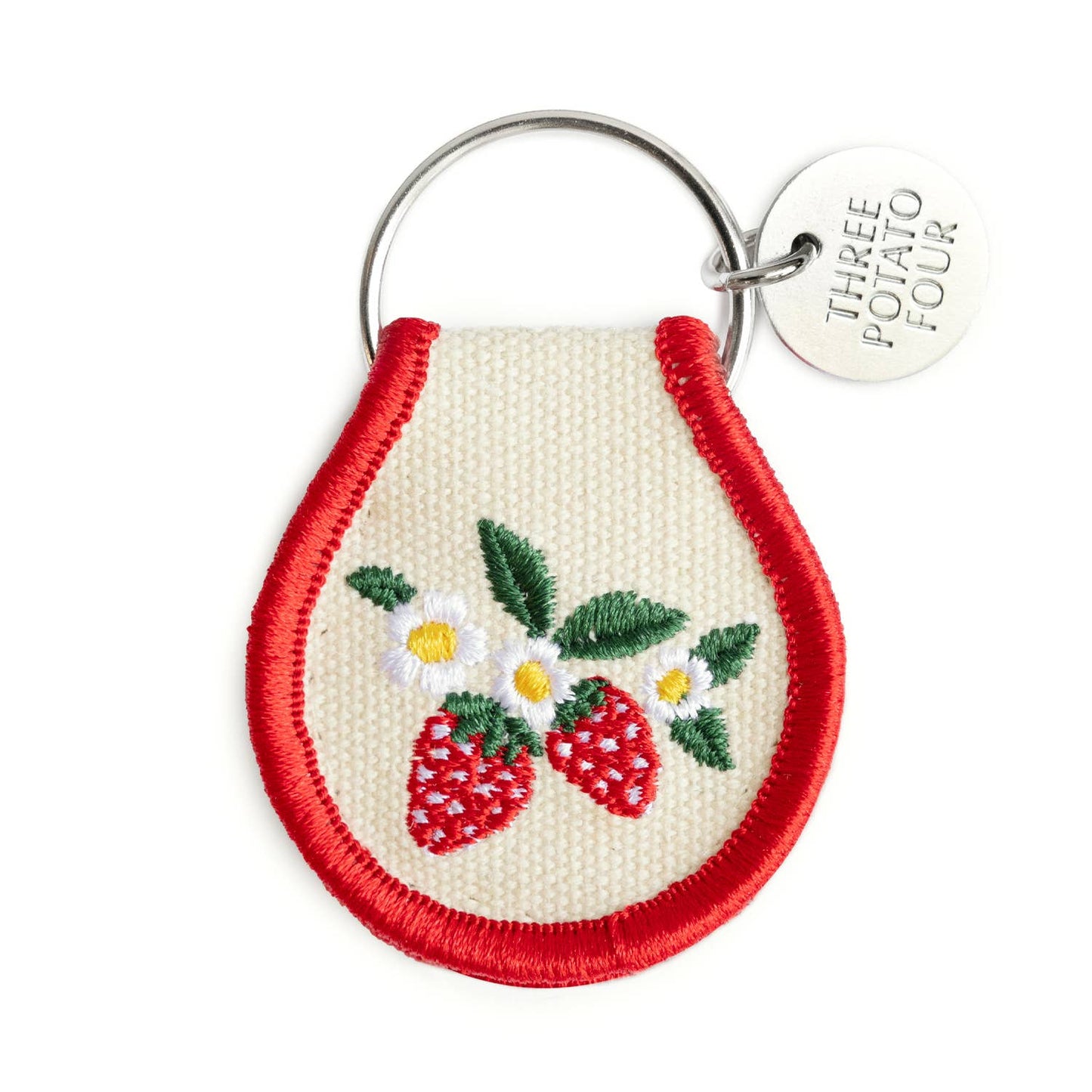 Keychain with embroidered strawberries and daisies on a white background