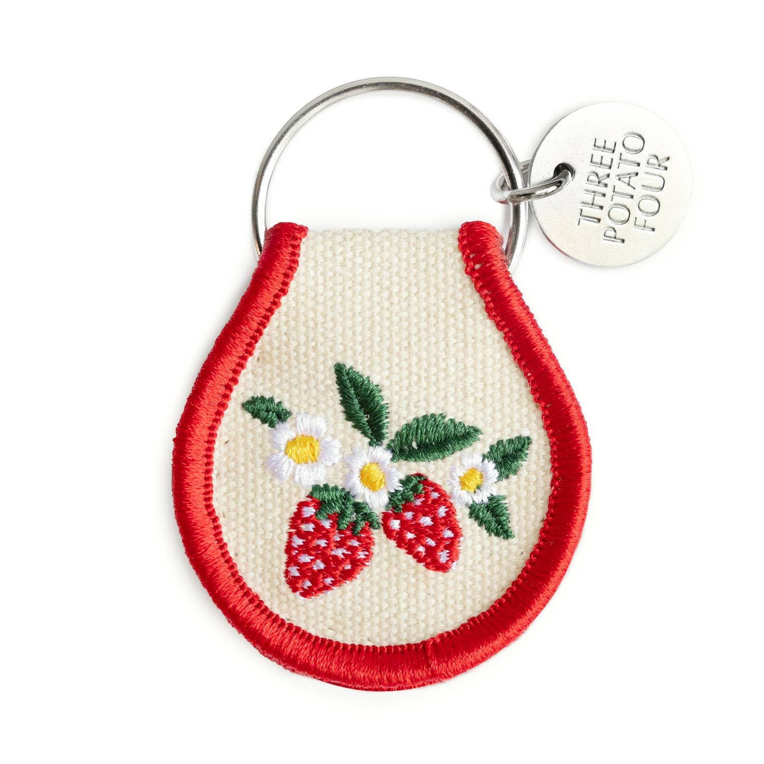 Keychain with embroidered strawberries and daisies on a white background