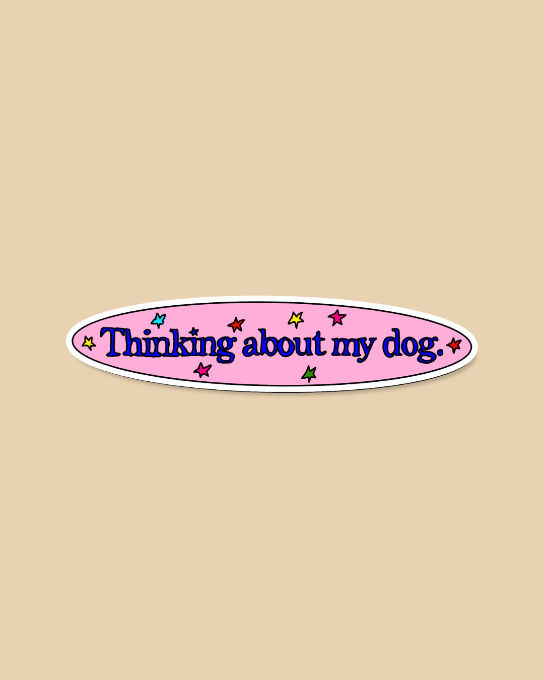 An oval sticker with the text 'Thinking about my dog.' in dark blue script, set on a pink background with small multicolored star accents and a white border, displayed on a solid beige background.
