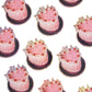 Pattern of pink cakes  on a white background
