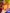 A hand holding a small illustrated notebook or card with a bright orange cover, featuring a large yellow cheese wedge and the text 'IS IT COFFEE TIME YET?' against a colorful, cartoon-filled background.