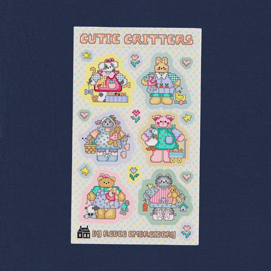 Sheet of 'Cutie Critters' stickers with cartoon characters on a blue background