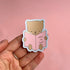 Sticker of a bear reading &