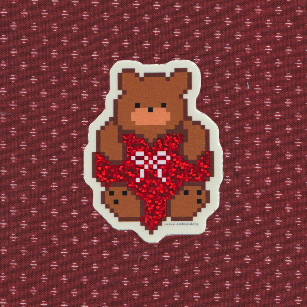 Pixelated bear with red heart and bow on a patterned background