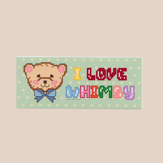 Pixelated teddy bear sticker with 'I Love Whimsy' text on a polka dot background