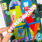Colorful sticker with 'OVERSTIMULATED' text held by a hand in front of a colorful background